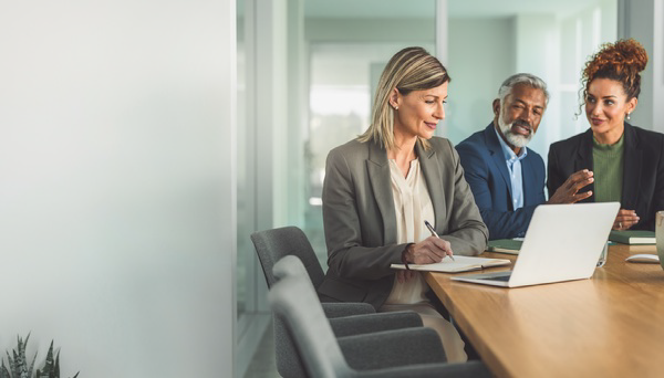 Three professionals in a planning discussion